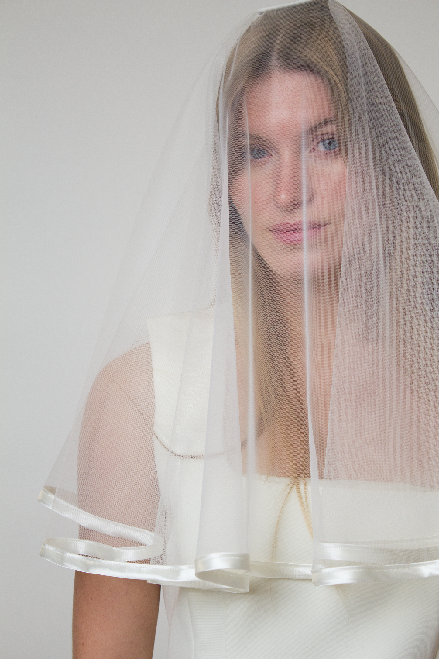 Satin trim bridal veil with blusher